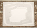 Venzi Capri 54 x 72 rectangular whirlpool bathtub installed in a bathroom